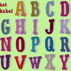May include: Crochet 3D Alphabet: A set of 26 colorful, crocheted letters, each with a white outline, arranged in alphabetical order. The letters are displayed against a light green background.