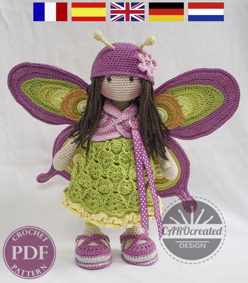 May include: Crochet pattern for a butterfly doll with purple wings, a green dress, and a purple hat. The doll has brown hair and a pink flower on her hat. The pattern is available as a PDF download. The text "CAROcreated DESIGN" is visible in the image.