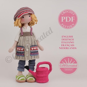 May include: A crocheted doll wearing a striped cap, a dress with heart-shaped pockets, and blue trousers. The doll holds a pink watering can. The image includes text that says "CROCHET PDF PATTERN" and lists several languages.