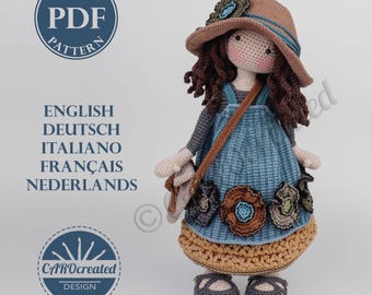 May include: Crochet doll pattern PDF in English, Deutsch, Italiano, Français, Nederlands. The doll is wearing a blue dress with brown straps, a brown hat with a flower, and brown shoes. The doll is holding a brown bag.