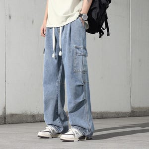 Men's Cargo Baggy Jeans | Straight Leg Denim Pants | Utility Pocket Streetwear Trousers | Y2K Fashion Gift for Him
.
Men’s baggy cargo jeans with straight-leg cut, elastic waist, and utility pockets, casual streetwear Y2K denim trousers.