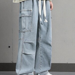 Men's Cargo Baggy Jeans | Straight Leg Denim Pants | Utility Pocket Streetwear Trousers | Y2K Fashion Gift for Him
.
Men’s baggy cargo jeans with straight-leg cut, elastic waist, and utility pockets, casual streetwear Y2K denim trousers.