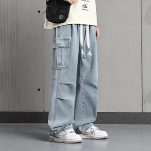 Men's Cargo Baggy Jeans | Straight Leg Denim Pants | Utility Pocket Streetwear Trousers | Y2K Fashion Gift for Him
.
Men’s baggy cargo jeans with straight-leg cut, elastic waist, and utility pockets, casual streetwear Y2K denim trousers.