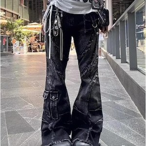 Women's Baggy Cargo Pants | Patchwork Denim Trouser Jeans | Streetwear Vintage Y2k Outfits

Model wearing baggy patchwork cargo denim pants with wide legs and grunge streetwear styling.