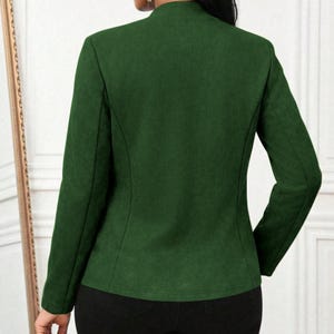 Women's Suede Jacket | Open Front Casual Blazer Coat | Chic Long Sleeve Outerwear | Elegant Fashion Layering Piece
.
Women's suede jacket with button details and open front design, tailored for chic layering and versatile outerwear. A stylish blazer-style coat for casual or formal outfits.