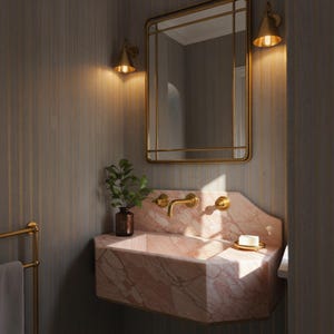 May include: A luxurious bathroom scene featuring a pink marble sink with gold fixtures, a matching gold-framed mirror, and sconces. A small plant in a brown vase sits on the sink. The walls are a muted gray with vertical gold stripes.