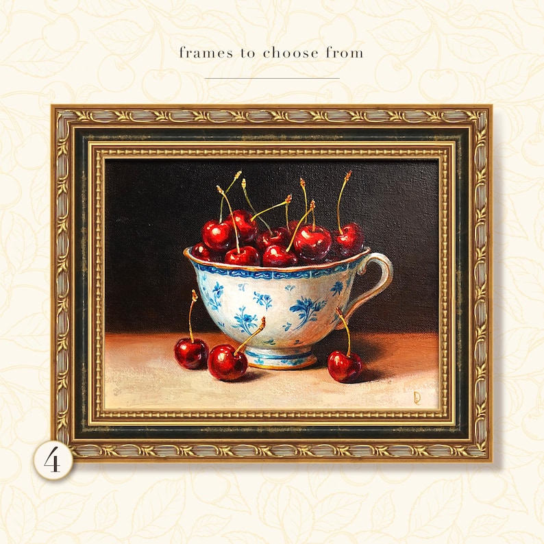 Puede incluir: Pintura enmarcada de naturaleza muerta con una taza llena de cerezas rojas. La taza tiene un dise&ntilde;o floral azul y blanco. El marco dorado adorna la pintura, con el texto "frames to choose from" en la parte superior.