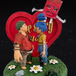 It Takes Two Game Inspired Figurine – May & Cody Scene with Book of Love
