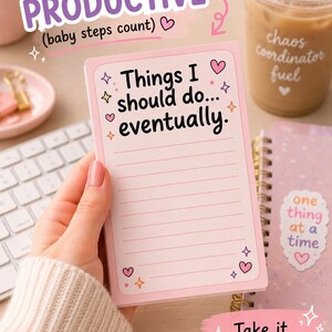 May include: A rectangular light pink notepad featuring the black text Things I should do... eventually. The notepad includes horizontal lines for writing, decorated with small pink hearts and four-pointed star icons in the corners of the page.