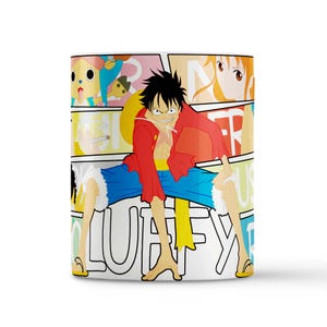 May include: White ceramic mug featuring a colorful comic-style design with the character Luffy from the anime series One Piece. The mug has a red, yellow, blue, and white color scheme, with the word "LUFFY" prominently displayed.