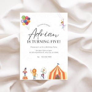 May include: A white invitation card with a circus theme. The card features a colorful balloon bunch, a trapeze artist, a lion, a ringmaster, a unicyclist, and a striped circus tent. The text on the card reads "It's time to party! Adrian is turning five! Please join us for a Birthday Party on April 12th at 2pm at 123 anywhere st., any city, st 12345 Tel. 123-456-7890"