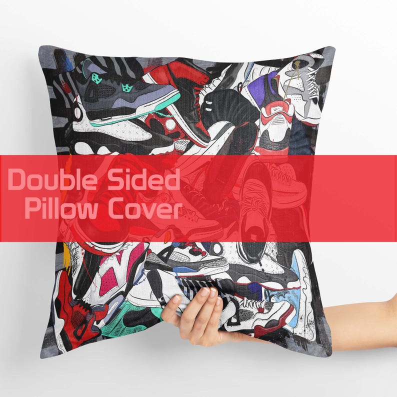 May include: A double-sided pillow cover featuring a collage of colorful sneakers in various styles. The design includes red, black, white, and blue shoes. The text "Double Sided Pillow Cover" is displayed across the center in a red banner.