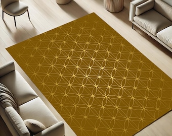 May include: A large, rectangular area rug with a repeating gold geometric pattern on a dark mustard-colored background. The rug is placed in a living room setting, with furniture visible around it.