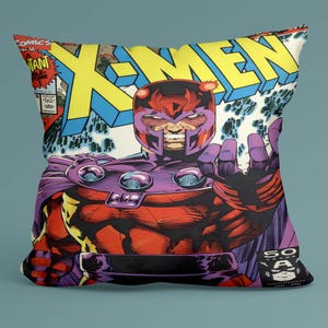 May include: Square throw pillow featuring a comic book cover with the X-Men logo in yellow and blue. The image depicts Magneto in a red and purple costume, with his hand outstretched. The pillow has a vintage comic book style.