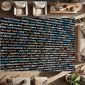 May include: A black and white rug with a code pattern. The code is in a variety of colours, including blue, green, orange, and yellow. The rug is on a floor with two chairs and a table.