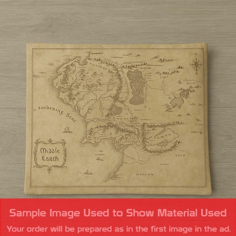 May include: A tan-colored map of Middle Earth, featuring detailed illustrations of the land, sea, and geographical features. The map includes the text "Middle Earth" and "Sundering Seas". The image is a sample to show the material used.