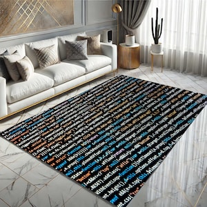 May include: A black and white rug with a code pattern printed on it. The rug is in a living room setting with a white sofa and a potted cactus.