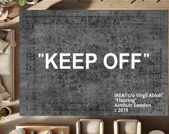 May include: A gray and black patterned rug with the text "KEEP OFF" in white. The rug is labeled "IKEA® c/o Virgil Abloh" "Flooring" Almhult Sweden c 2019 TM.