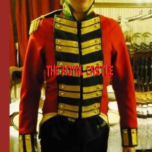 May include: A red military-style jacket with black and gold accents. The jacket features gold buttons, epaulettes, and trim. The text "THE ROYAL CASTLE" is displayed across the front of the jacket.