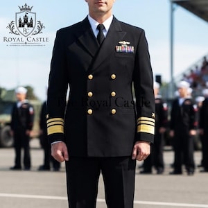 May include: A black double-breasted naval uniform jacket featuring gold buttons, gold sleeve stripes, and a multi-colored ribbon bar on the chest. The jacket is worn with a white collared shirt and a black necktie, presenting a formal military appearance.