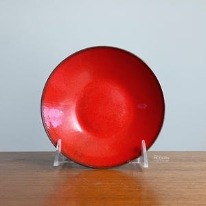 May include: A set of three ceramic mugs with a speckled, matte finish. The mugs are in shades of cream, light gray, and dark gray. Each mug has a simple, minimalist design and a rounded handle. Perfect for coffee or tea.