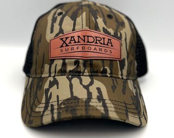 Leather Patch Camo Trucker Hat: Xandria Surfboards Mossy Oak Bottomland, Richardson 111 unstructured