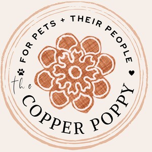 May include: A brown and white floral design with the text "the COPPER POPPY" and "FOR PETS + THEIR PEOPLE" in a circle.