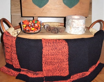 four large 100 percent cotton machine knit dishcloths done in halloween colors...11 X 12 inches