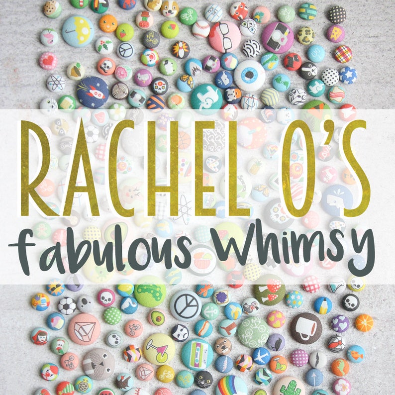 May include: A collection of colorful, fabric-covered buttons with various designs, including animals, geometric shapes, and symbols. The buttons are arranged in a circular pattern on a light gray surface. The text "Rachel's fabulous whimsy" is displayed in a white banner across the top of the image.