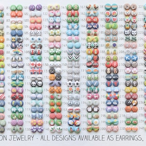 May include: A grid of 300 colorful fabric buttons with various designs, including animals, geometric patterns, and symbols. The buttons are arranged in rows and columns, and each button has a number printed on it. The text "RACHEL O'S FABRIC BUTTON JEWELRY - ALL DESIGNS AVAILABLE AS EARRINGS, CUFFLINKS, AND HAIRPINS" is printed at the bottom of the image.