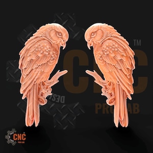 May include: Two identical peach-colored carved bird figures, each perched on a textured branch. The birds are depicted in profile, facing inward toward each other, with detailed feather textures and sharp beaks. The background features a dark logo.
