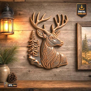 May include: A bronze-toned wall relief sculpture featuring a deer head with large antlers positioned next to a stylised evergreen tree. The relief has a metallic finish with dark shading in the recessed areas to highlight the texture of the fur.