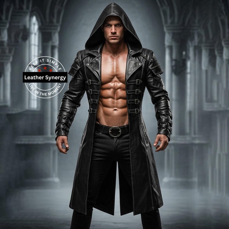 May include: A black leather hooded coat with multiple buckles and a belt. The coat features shoulder accents and a long, flowing design. The image includes the text "Leather Synergy" and "Keep it Simple, Live in the Moment".