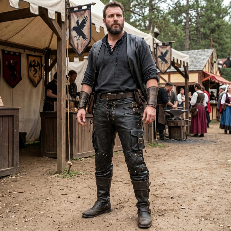 May include: A person wearing a black leather outfit with a vest, pants, and boots. The pants have pockets and decorative stitching. The outfit is accessorized with a brown belt, pouches, and wrist cuffs. The background shows a medieval fair setting.