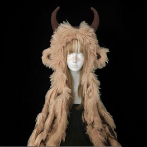 May include: A set of three ceramic mugs with a speckled, matte finish. The mugs are in shades of cream, light gray, and dark gray. Each mug has a simple, minimalist design, perfect for coffee or tea.