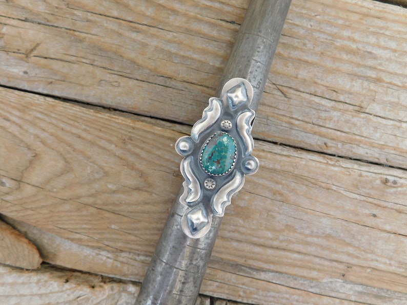 a Navajo silversmith with Kingman turquoise ON SALE Turquoise repousse ring handmade and signed in sterling silver 925 by Tim Yazzie