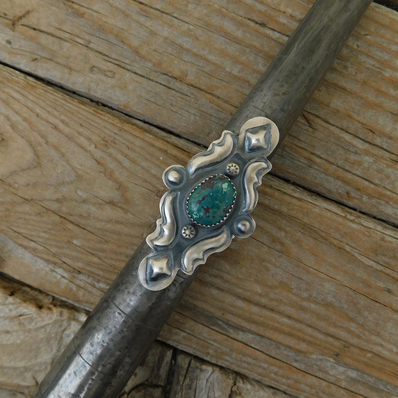 a Navajo silversmith with Kingman turquoise ON SALE Turquoise repousse ring handmade and signed in sterling silver 925 by Tim Yazzie