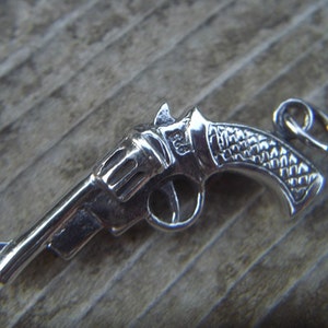 Revolver pendant handmade in sterling silver