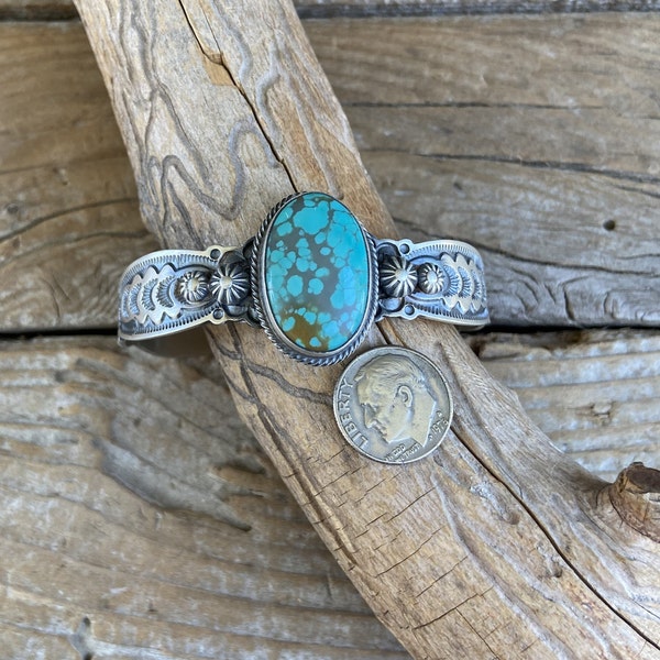 Beautifully stamped turquoise cuff bracelet handmade and signed by a Navajo silversmith with a Pilot Mountain turquoise stone
