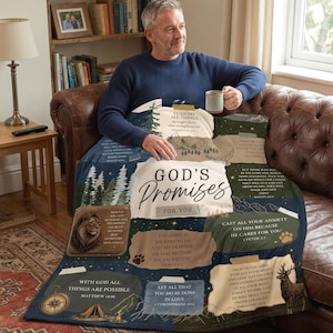 May include: A soft throw blanket featuring a dark blue and earth-toned design with the text "God's Promises For You". The blanket displays various religious verses, illustrations of a lion, a deer, mountains, pine trees, and a compass.