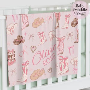 Custom cowgirl fleece blanket with pink fringe edges, an adorable and cozy western girl gift for birthdays, baby showers, or as a charming addition to a country-style nursery.