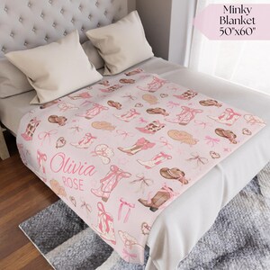Vintage western wagon wheel and saddle baby blanket with hand-stitched details, ideal for rustic cowgirl nursery décor, western-themed baby shower gift, or heirloom keepsake.