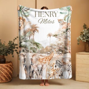 Safari-themed personalized baby blanket with boy’s name, soft plush material for newborns, toddlers, and safari nursery or jungle room décor.