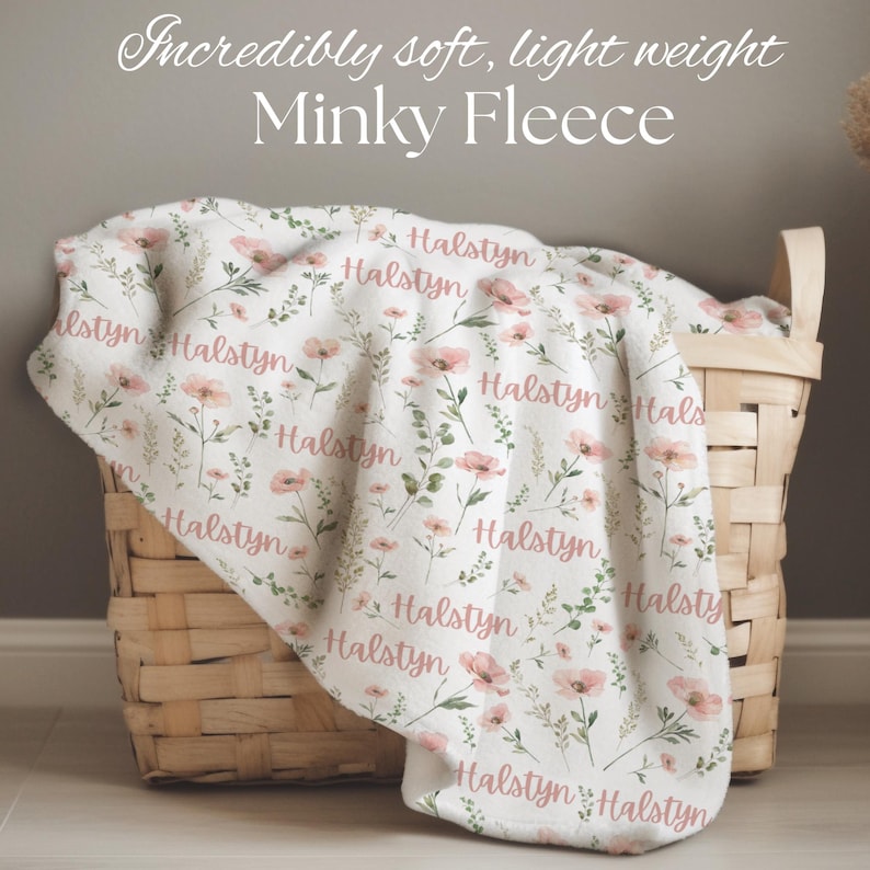 Personalized wildflower swaddle blanket as a holiday gift for baby girl, ideal for Christmas morning snuggles or winter nursery photoshoots.