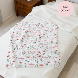 Wildflower blanket for baby’s first going home outfit, personalized with her name and wrapped in soft florals for that precious ride home from the hospital.