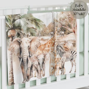 May include: A baby swaddle blanket, 30"x40", features a watercolor illustration of African animals. The design includes elephants, giraffes, zebras, and lions in a naturalistic setting with palm trees and a watering hole.