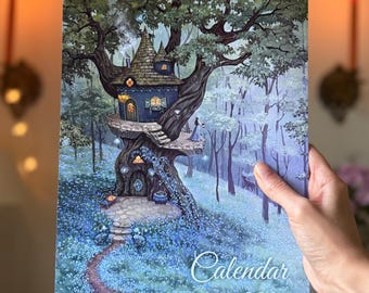 May include: A spiral-bound wall calendar for the year 2027 featuring a detailed illustration of a multi-story treehouse dwelling nestled within a dense forest. The artwork displays a blue structure built into a large tree, surrounded by blue flowers.