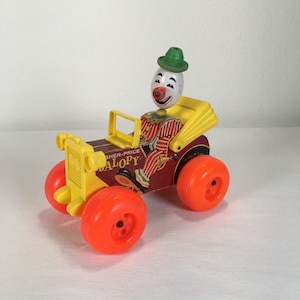 Cochecito de payaso Jalopy de Fisher-Price, modelo vintage de 1965, de madera, sin cuerda.