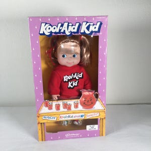 May include: A set of three ceramic mugs with a speckled, matte finish. The mugs are in shades of cream, light gray, and dark gray. Each mug has a simple, minimalist design, perfect for coffee or tea.