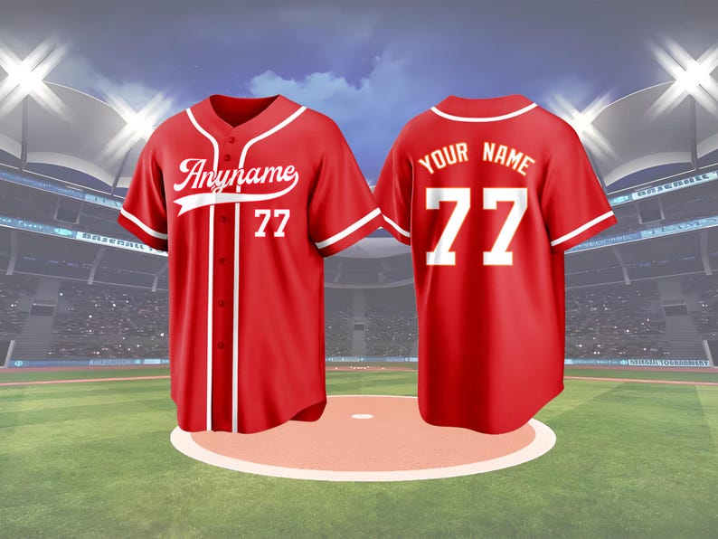 May include: Two red baseball jerseys with white accents. The front jersey has the text "Anyname" and the number "77". The back jersey has the text "Your Name" and the number "77". The jerseys are displayed on a baseball field.